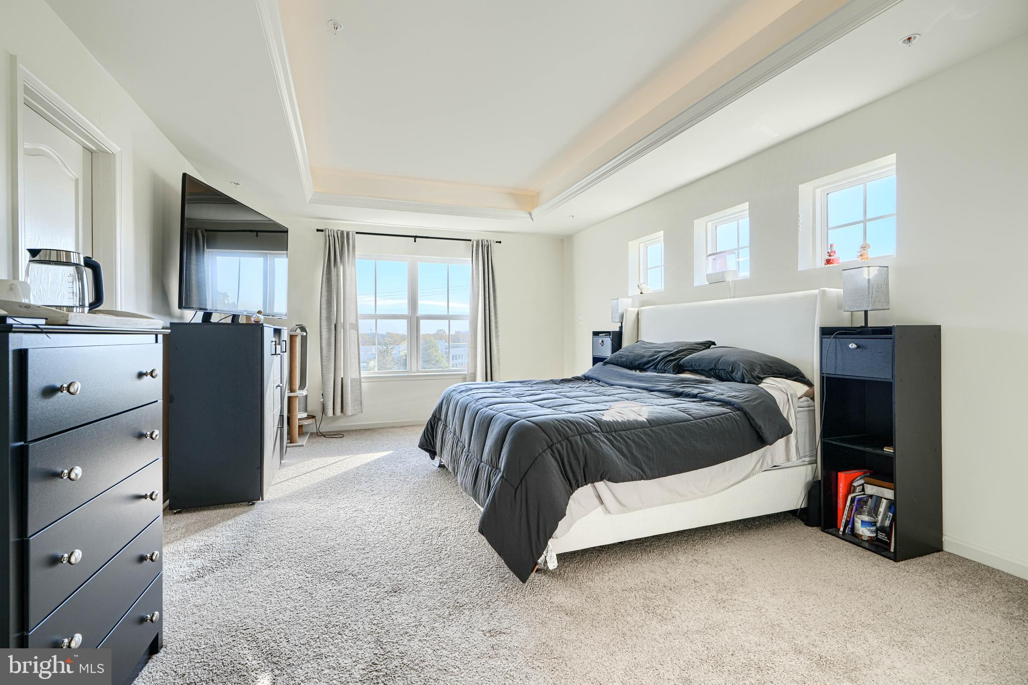 7141 Millstone Road Hanover, MD 21076 - Photo 24 of 32 a spacious bedroom with a bed and a dresser