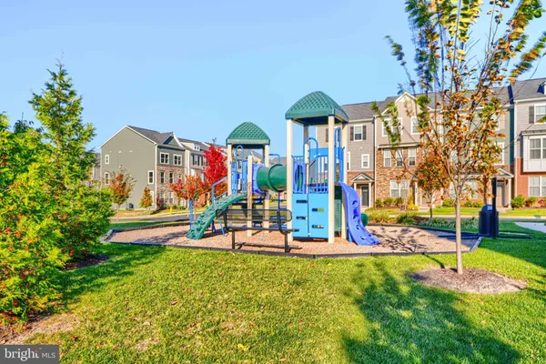 swimming view of outdoor space with playground and green space