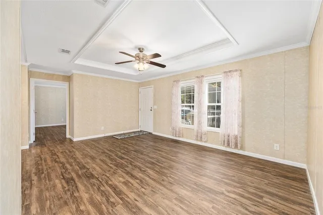 a kitchen with stainless steel appliances granite countertop a refrigerator a stove top oven and a sink