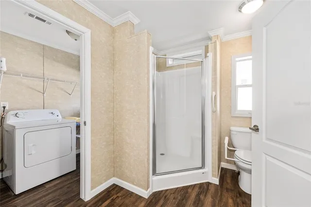 a view of a room with wooden floor and closet