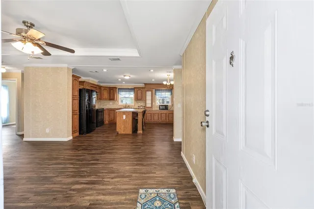 a view of a kitchen with a sink and microwave