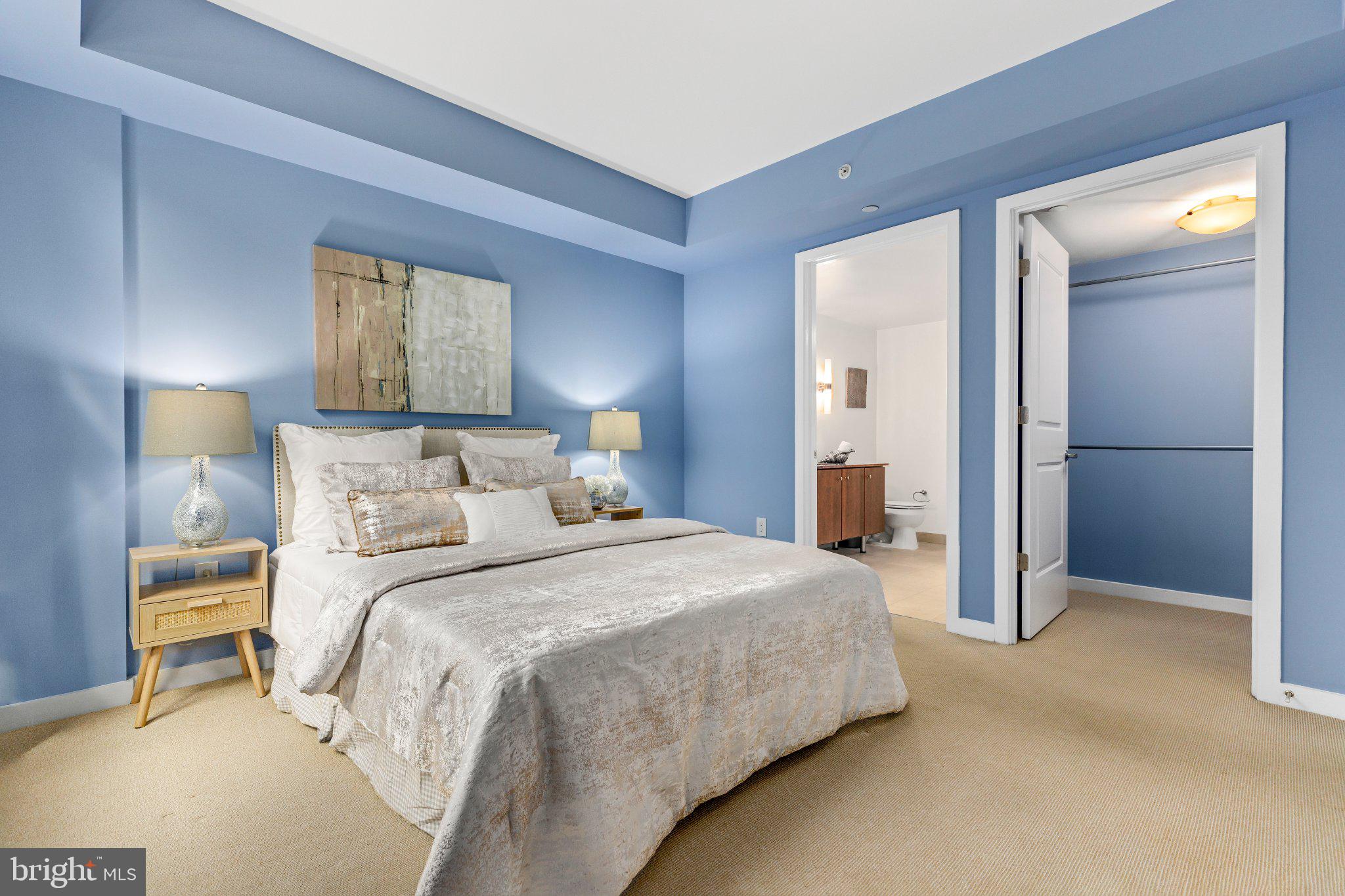 1025 First Street Southeast, Unit 611 Washington, DC 20003 - Photo 13 of 34 Serene blue-hued bedroom retreat.