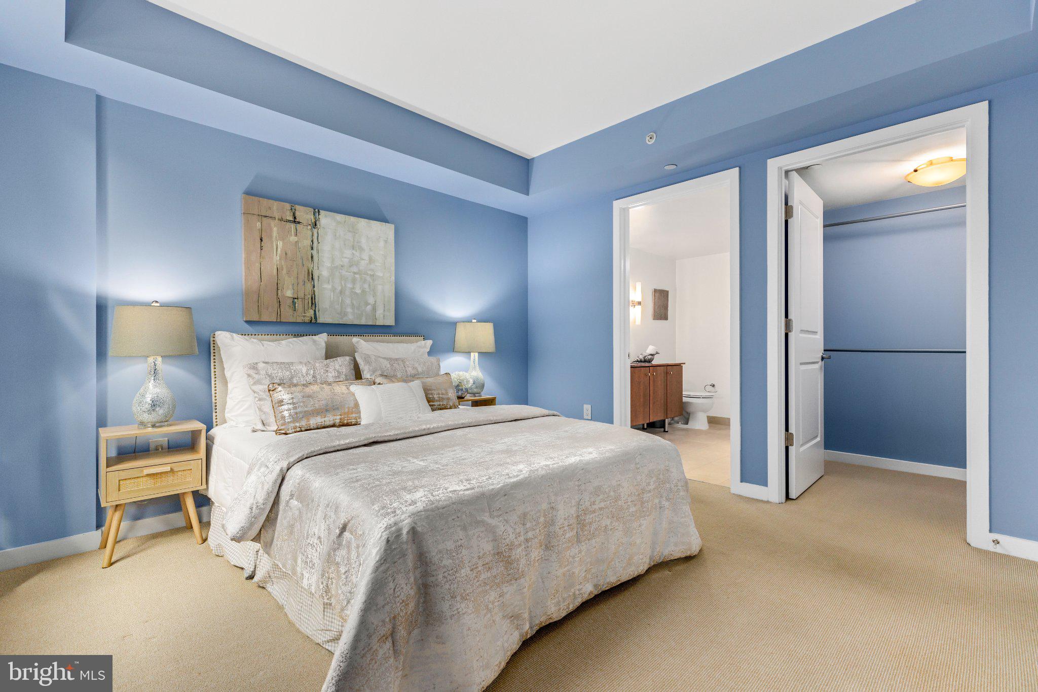 1025 First Street Southeast, Unit 611 Washington, DC 20003 - Photo 15 of 34 Serene blue-hued bedroom retreat.