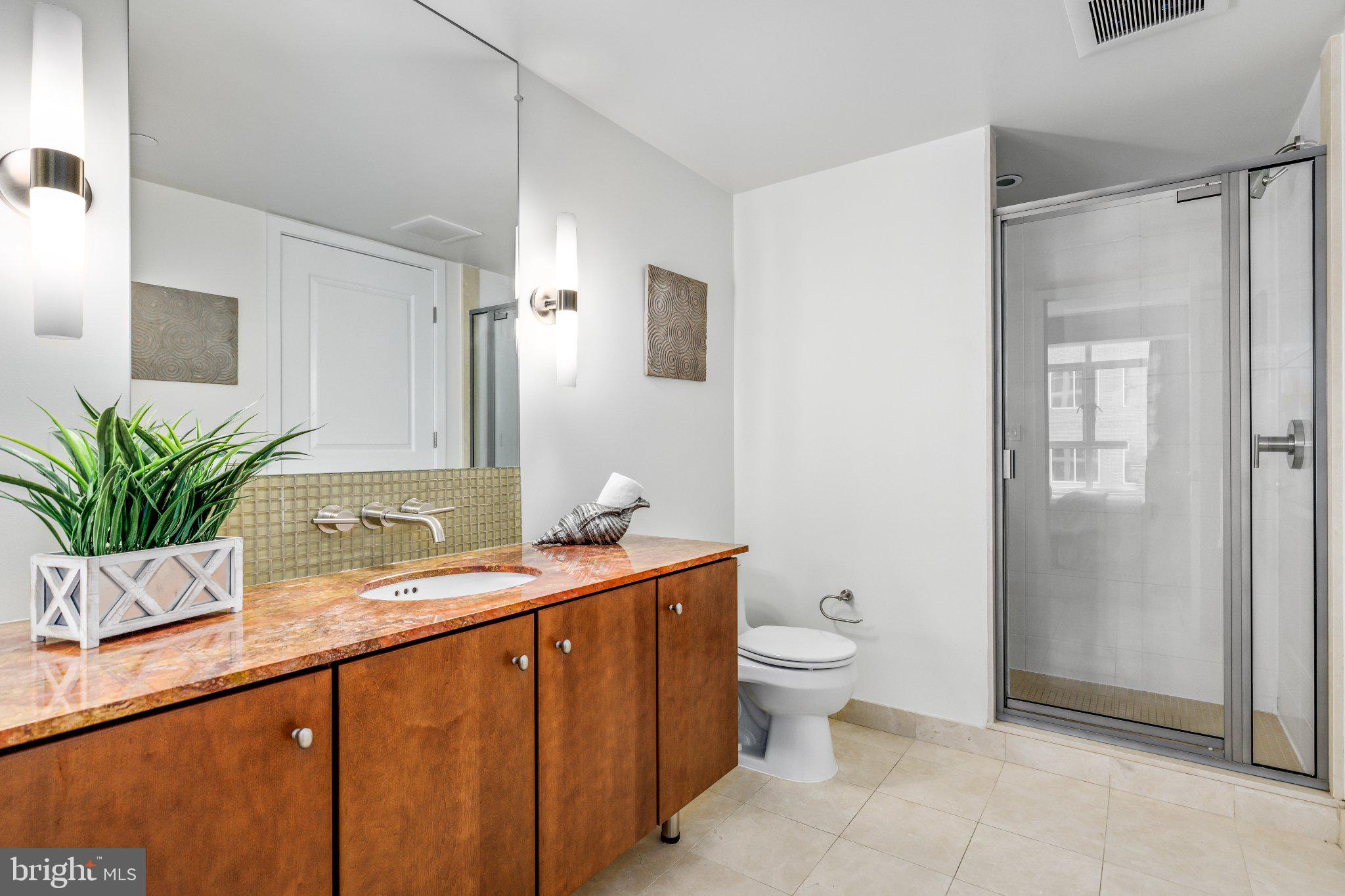 1025 First Street Southeast, Unit 611 Washington, DC 20003 - Photo 19 of 34 Sleek modern bathroom with elegance.