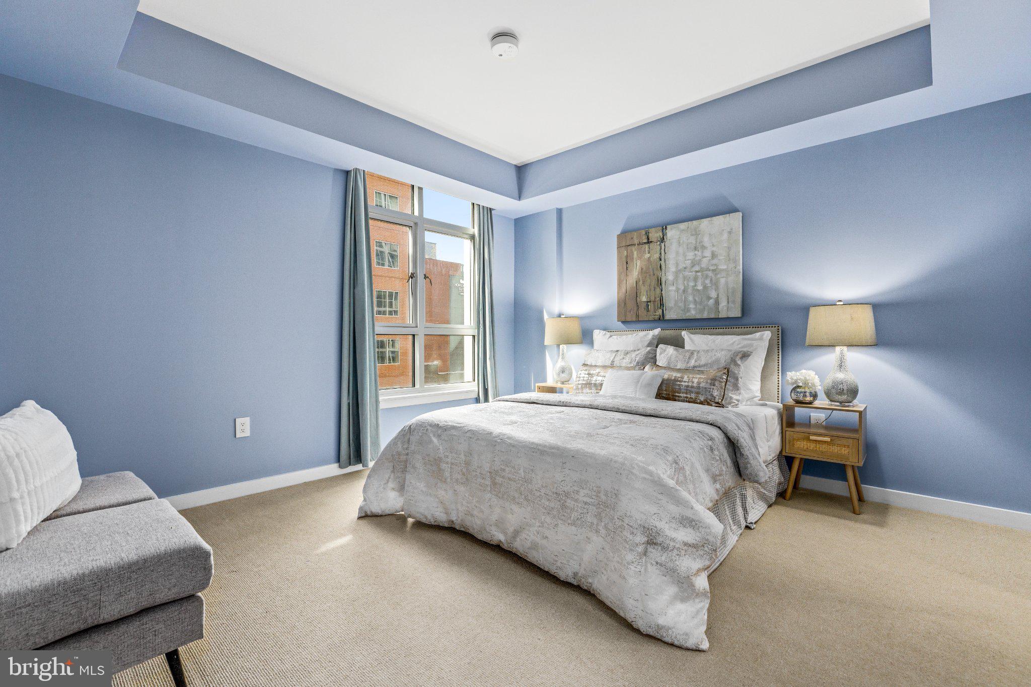 1025 First Street Southeast, Unit 611 Washington, DC 20003 - Photo 28 of 34 Serene blue-hued bedroom retreat.