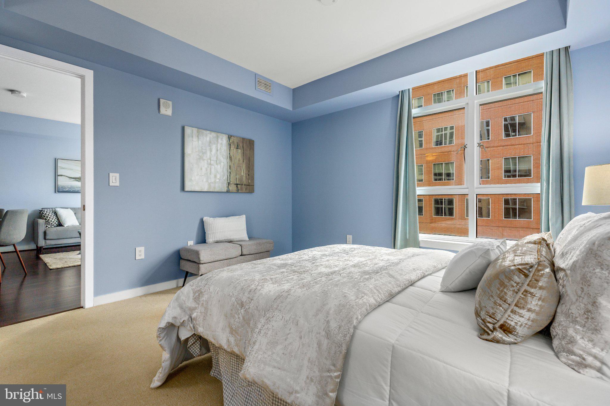 1025 First Street Southeast, Unit 611 Washington, DC 20003 - Photo 29 of 34 Serene blue-hued bedroom retreat.