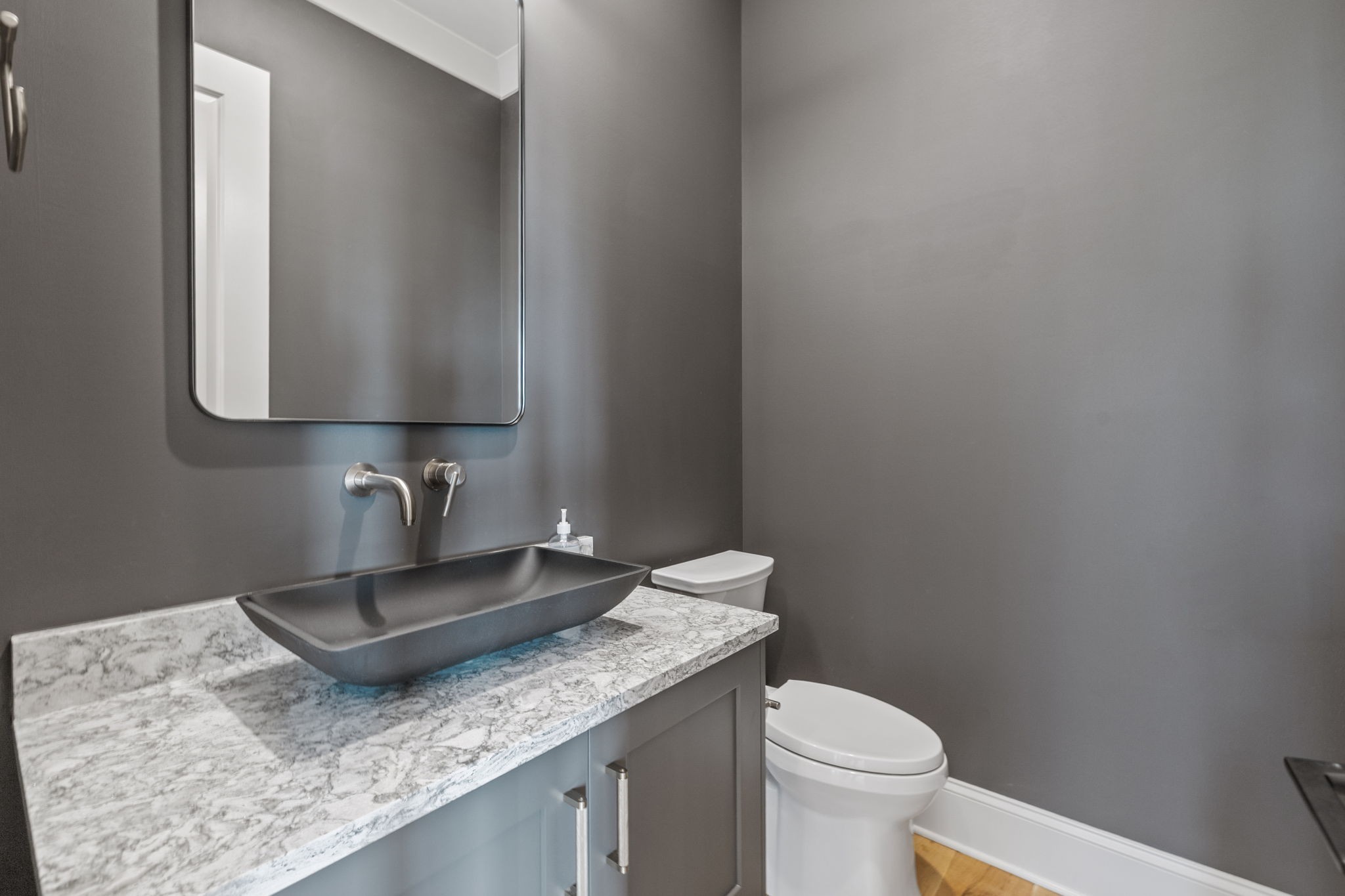 2245 Skinner Road Arrington, TN 37014 - Photo 43 of 98 a bathroom with a granite countertop toilet sink and mirror