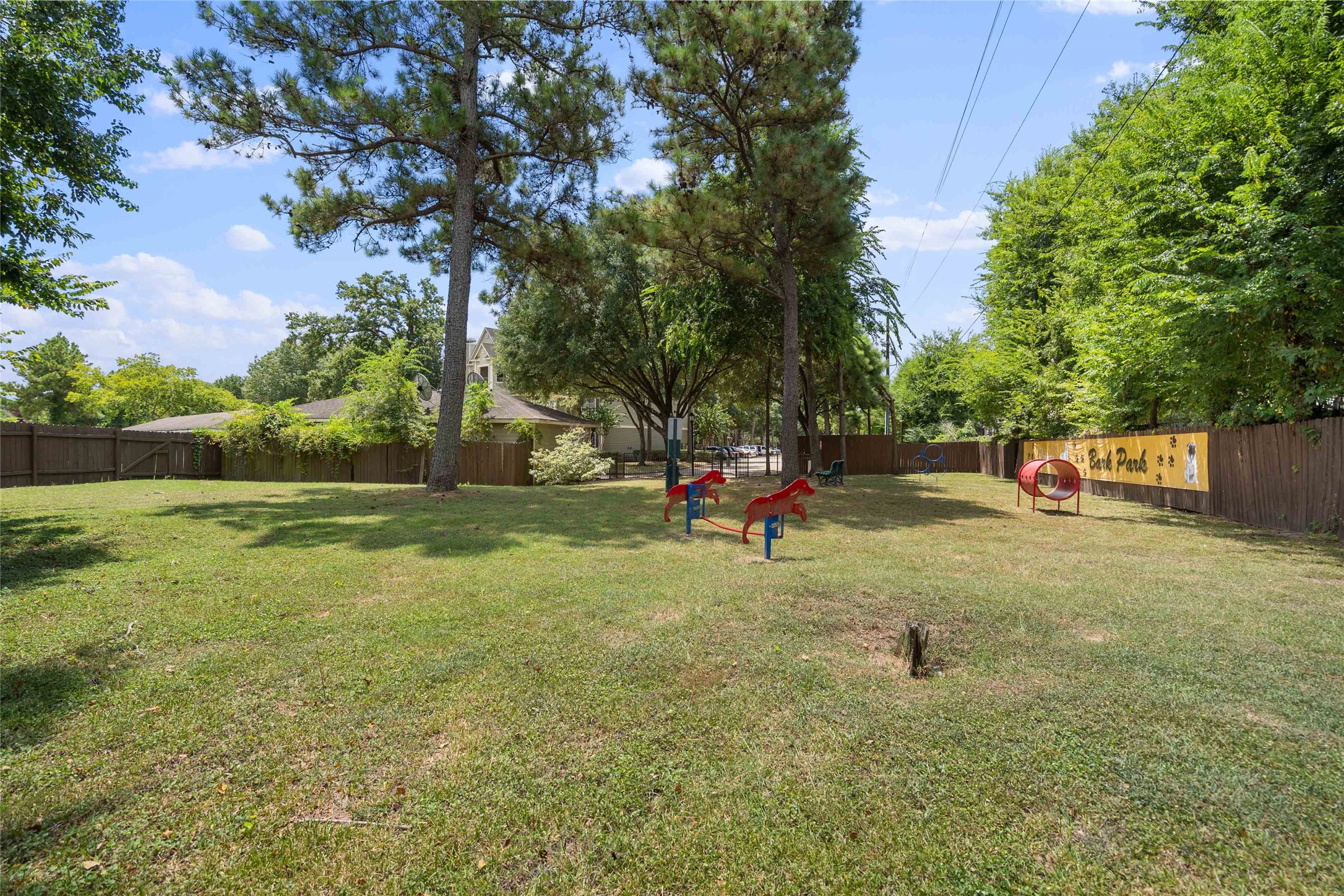 2400-1123 Spring Rain Drive Spring, TX 77379 - Photo 26 of 35 a view of a park with swings and slides