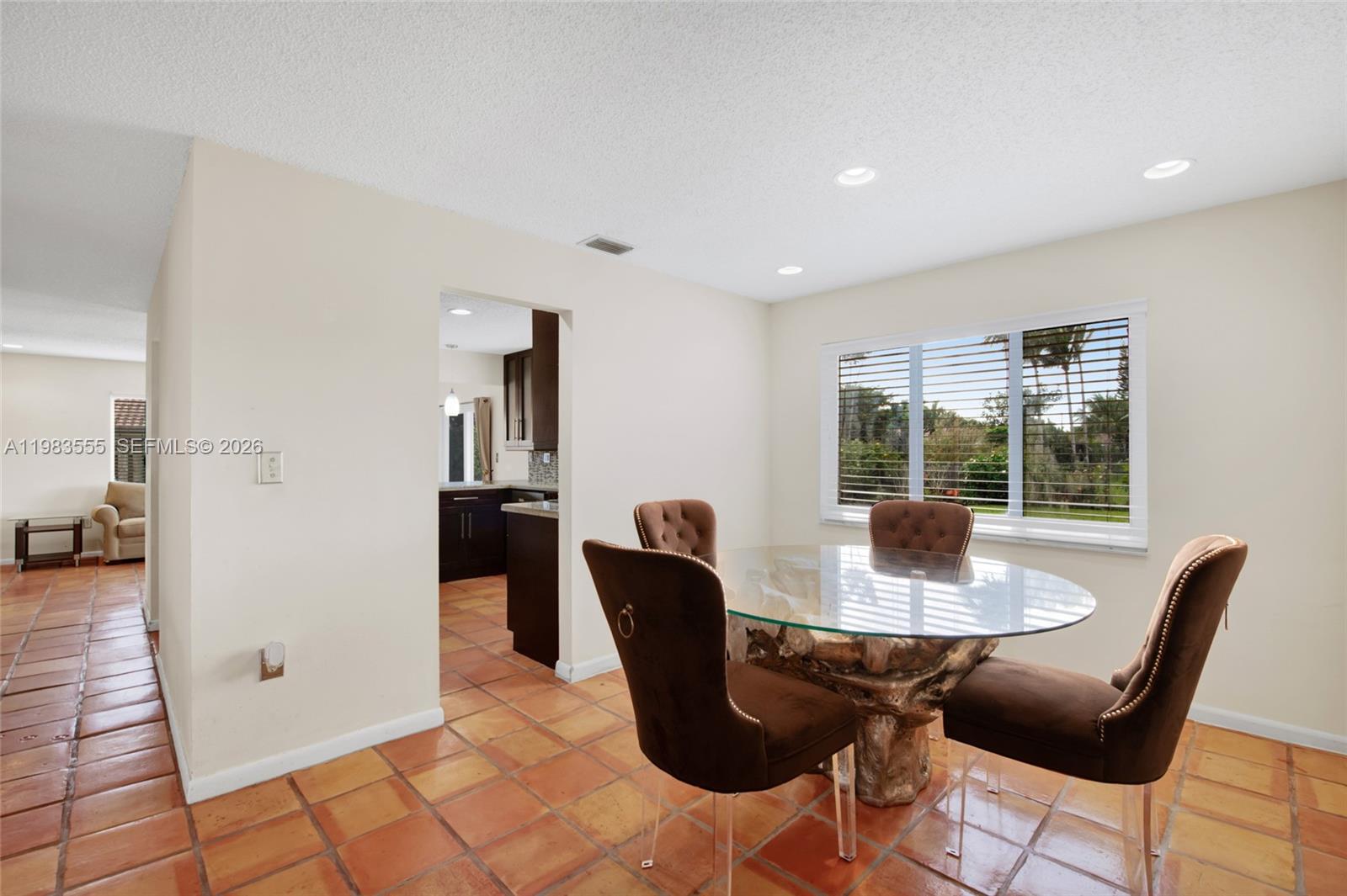 5757 Southwest 113th Avenue Cooper City, FL 33330 - Photo 15 of 48 a view of a dining room with furniture and a window