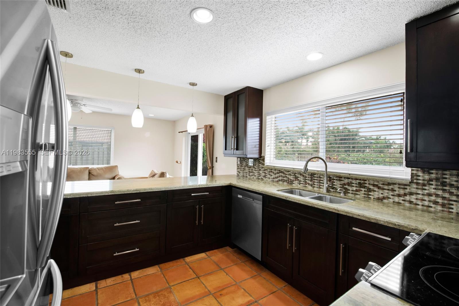 5757 Southwest 113th Avenue Cooper City, FL 33330 - Photo 16 of 48 a kitchen with a sink and large window