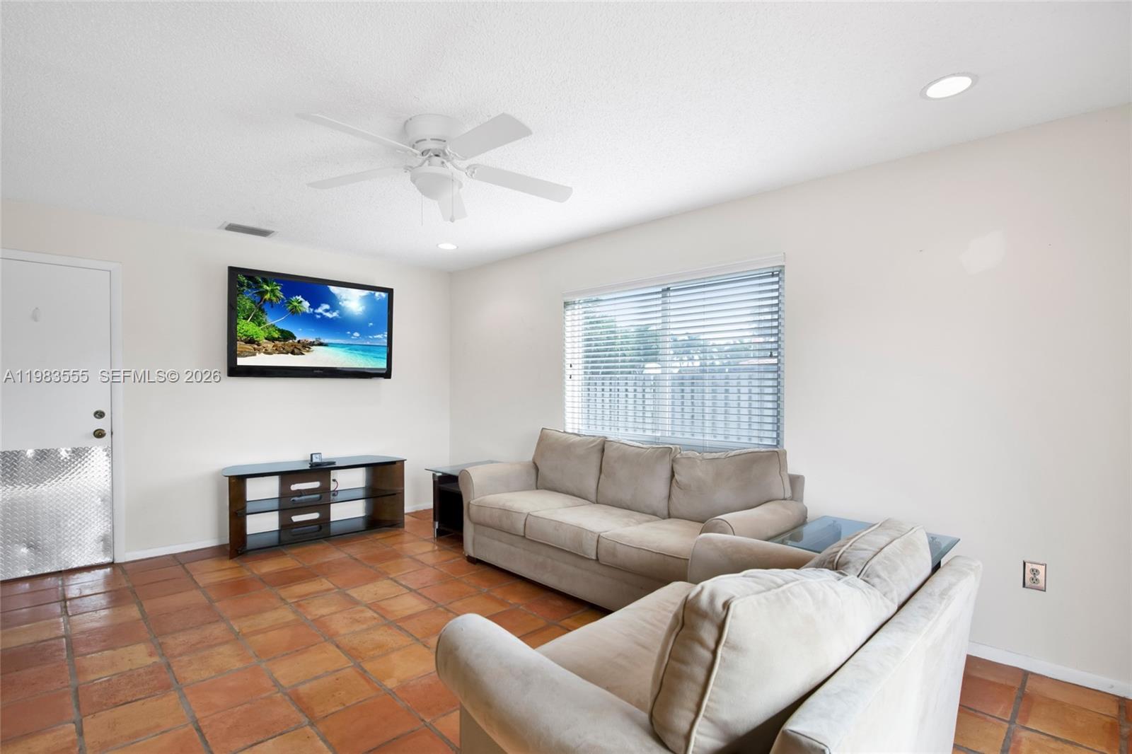 5757 Southwest 113th Avenue Cooper City, FL 33330 - Photo 20 of 48 a living room with furniture and a window