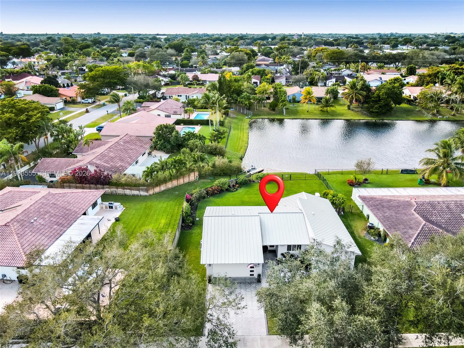 5757 Southwest 113th Avenue Cooper City, FL 33330 - Photo 2 of 48 an aerial view of a house with a lake view