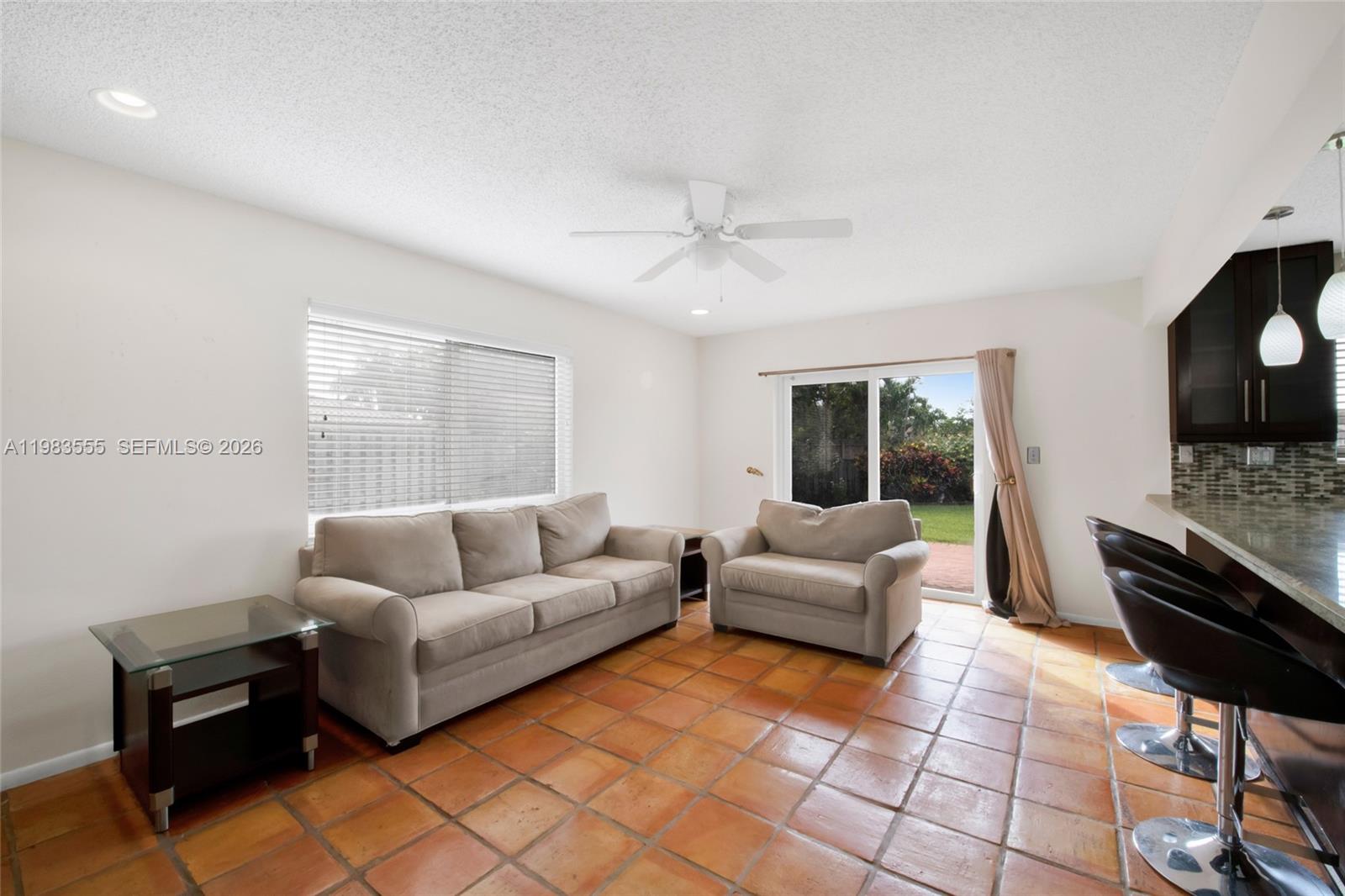 5757 Southwest 113th Avenue Cooper City, FL 33330 - Photo 21 of 48 a living room with furniture and a flat screen tv