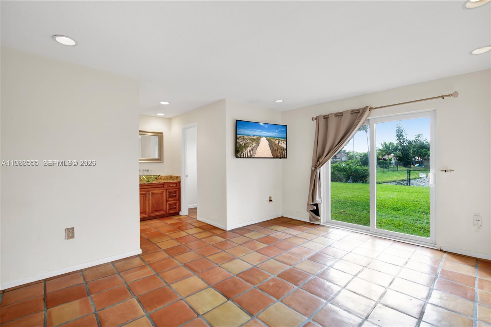 5757 Southwest 113th Avenue Cooper City, FL 33330 - Photo 22 of 48 a view of a livingroom with a floor to ceiling window and an entryway