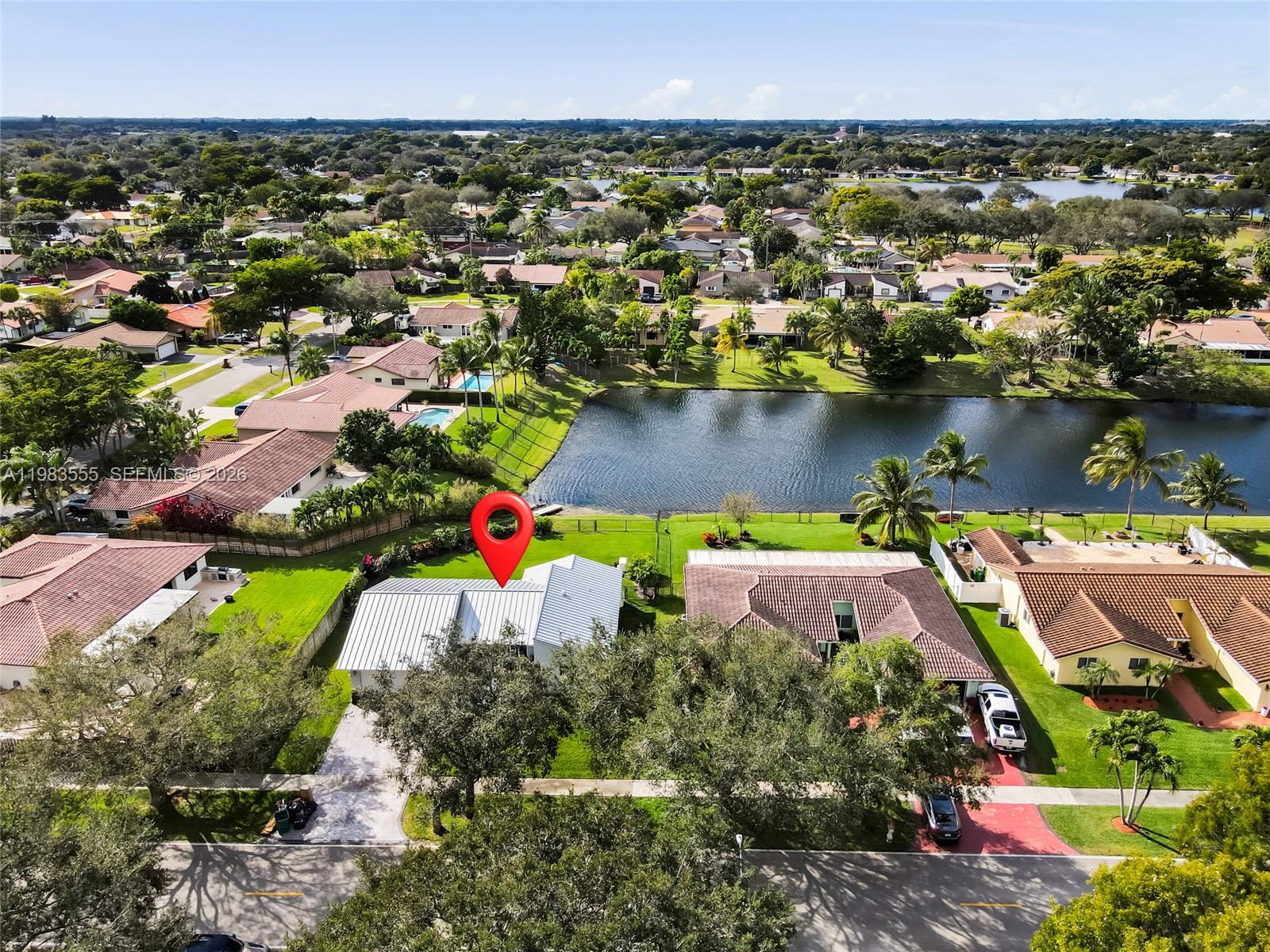 5757 Southwest 113th Avenue Cooper City, FL 33330 - Photo 42 of 48 an aerial view of house with yard and lake view