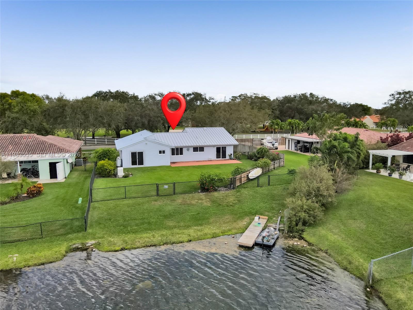 5757 Southwest 113th Avenue Cooper City, FL 33330 - Photo 44 of 48 a view of a house with a yard