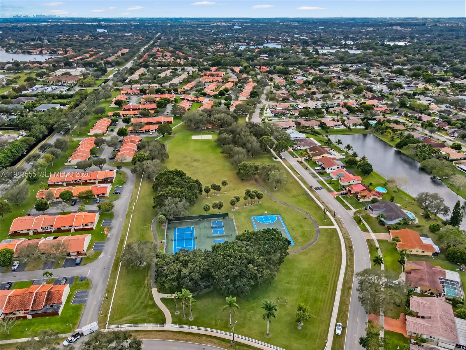 5757 Southwest 113th Avenue Cooper City, FL 33330 - Photo 47 of 48 an aerial view of residential houses with outdoor space