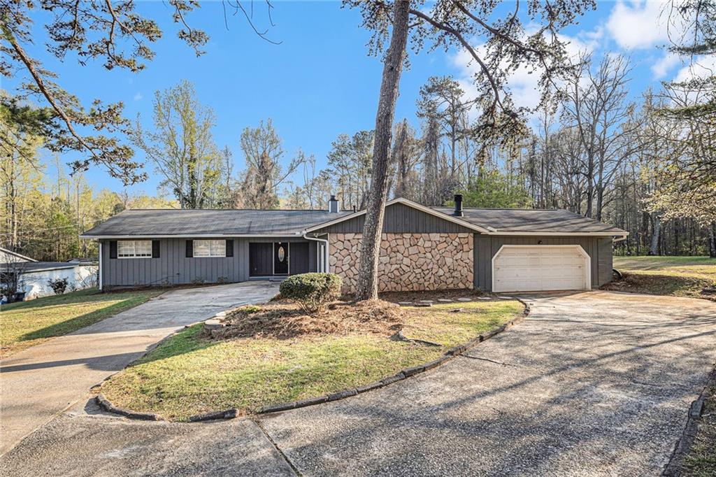 7280 Rivertown Road Fairburn, GA 30213 - Photo 1 of 1 a view of a house with a yard covered in snow
