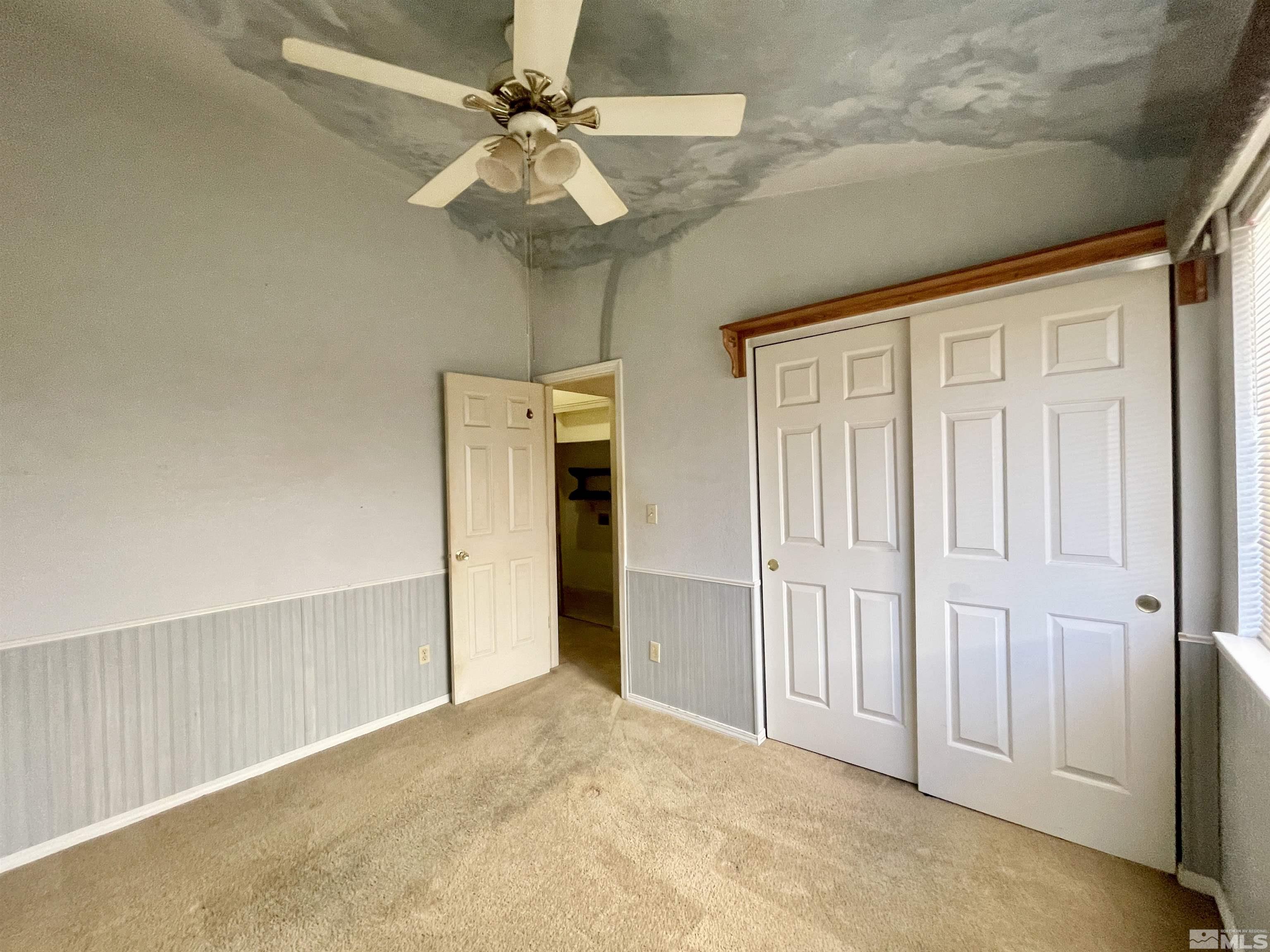 6930 Flower Street Reno, NV 89506 - Photo 12 of 19 a view of a livingroom with a chandelier fan