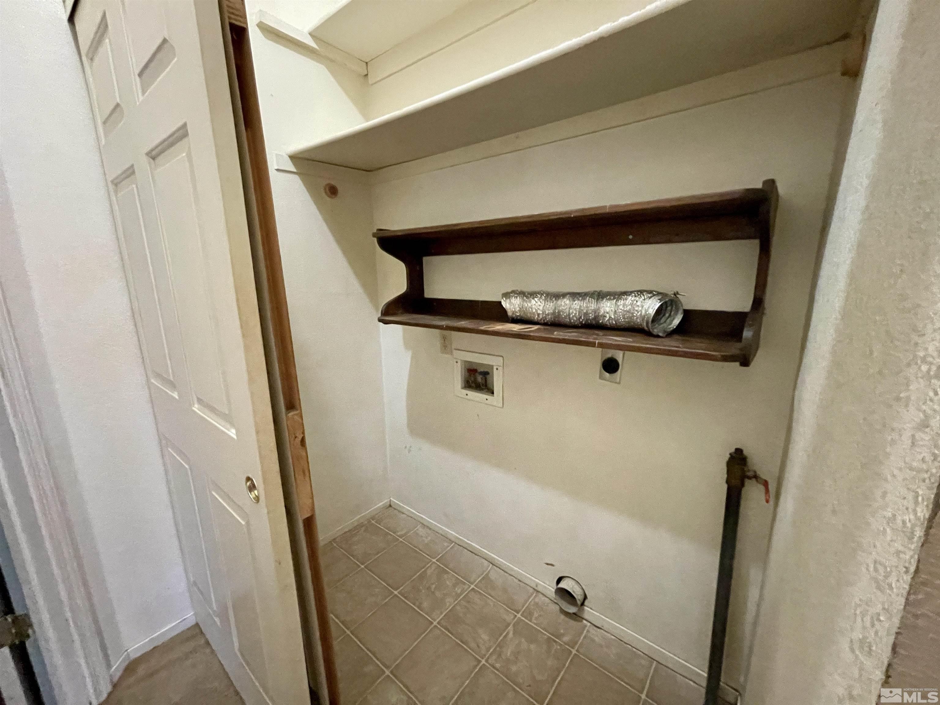 6930 Flower Street Reno, NV 89506 - Photo 14 of 19 a bathroom with a sink and glass door