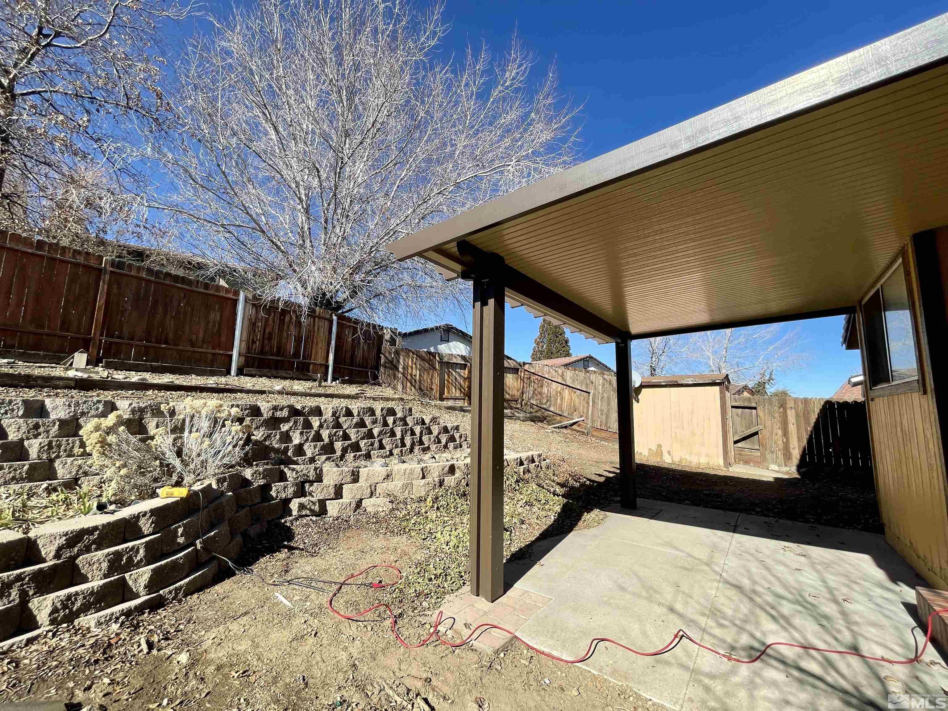 6930 Flower Street Reno, NV 89506 - Photo 17 of 19 a view of a backyard of the house