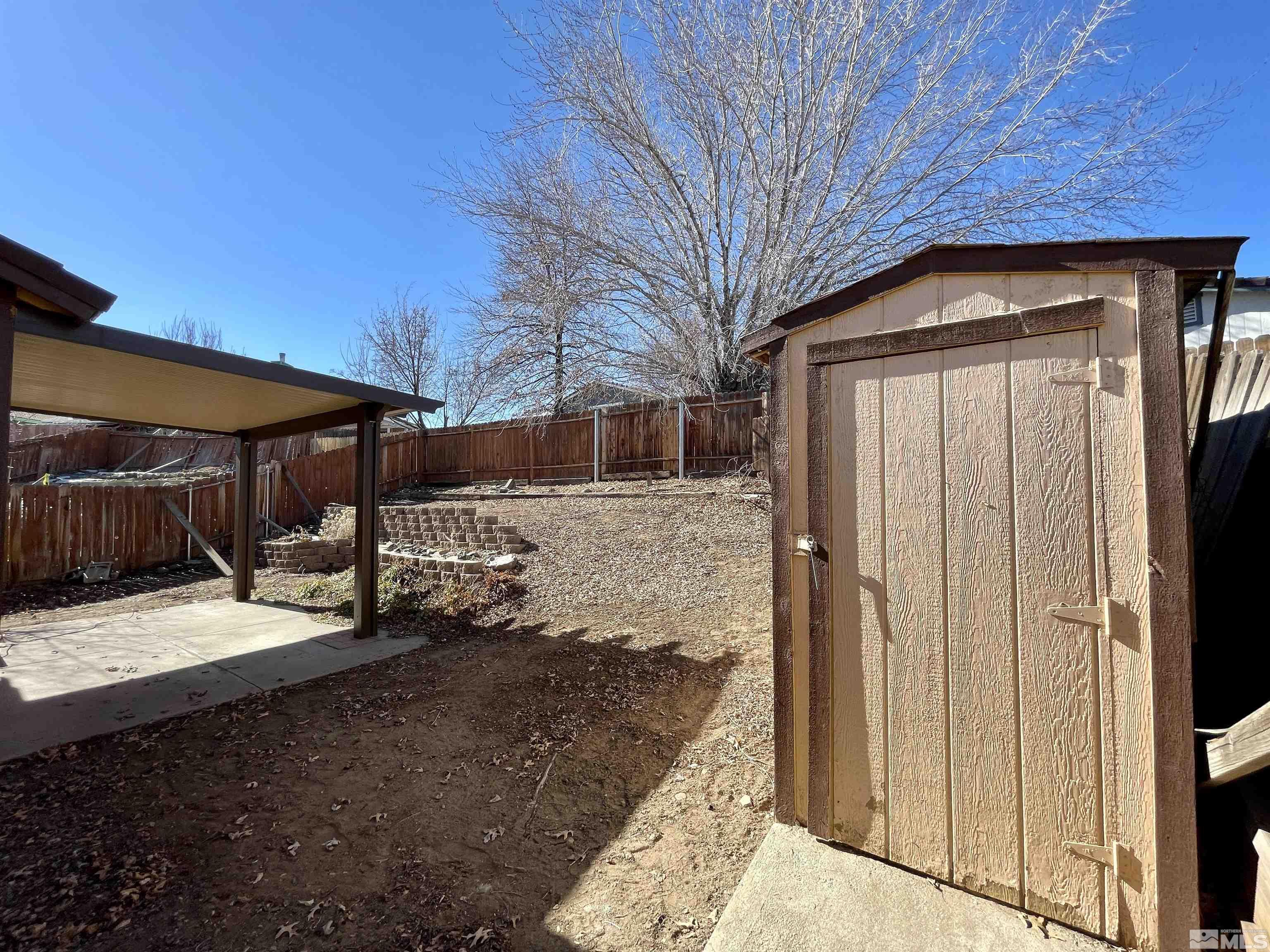 6930 Flower Street Reno, NV 89506 - Photo 18 of 19 a view of a house with a snow on the road