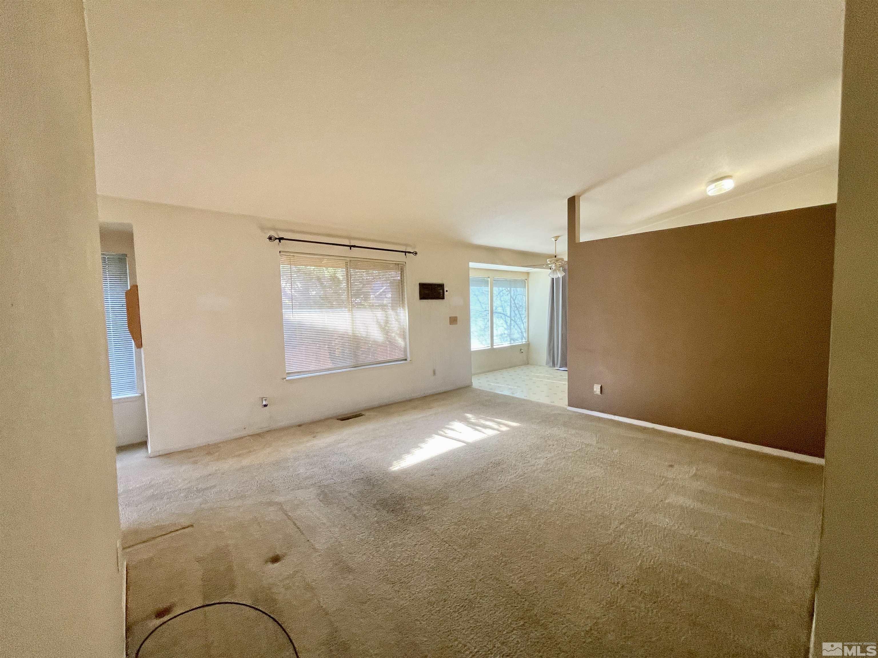 6930 Flower Street Reno, NV 89506 - Photo 4 of 19 an empty room with windows