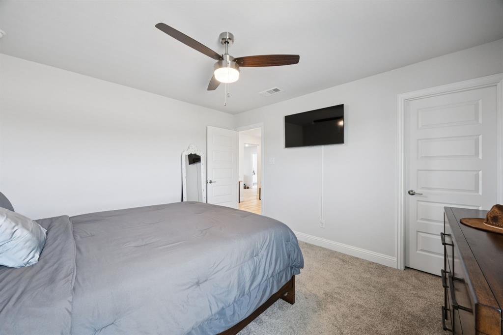 722 Cari Lane Forney, TX 75126 - Photo 22 of 40 a view of a livingroom with a flat screen tv
