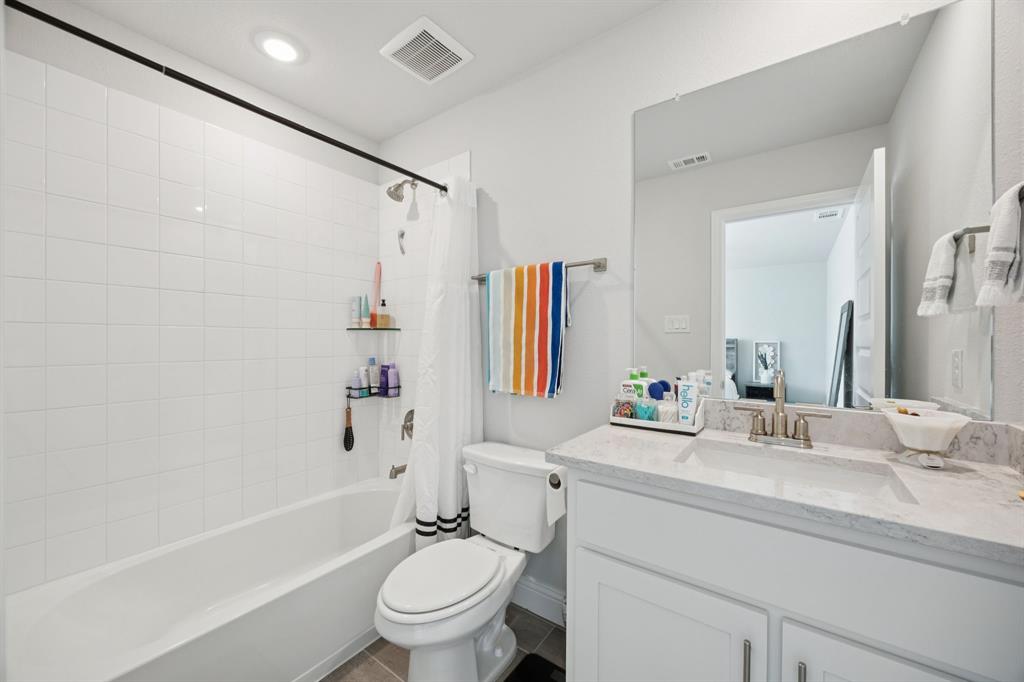 722 Cari Lane Forney, TX 75126 - Photo 26 of 40 a bathroom with a sink toilet tub and shower