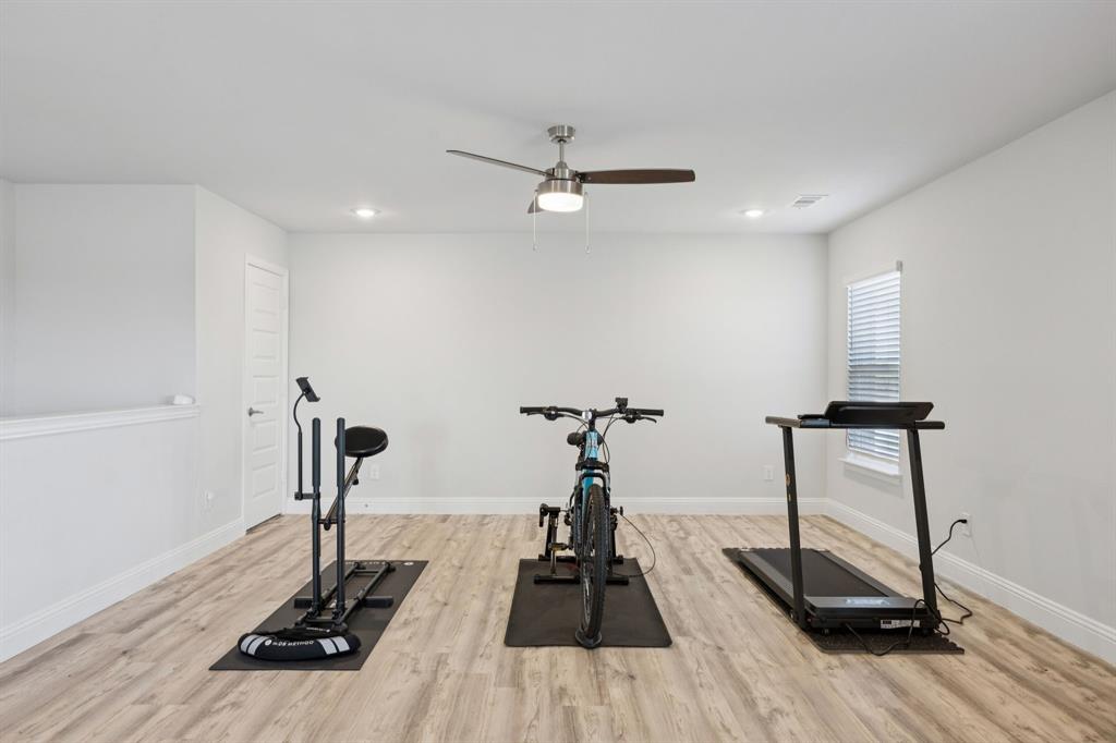 722 Cari Lane Forney, TX 75126 - Photo 27 of 40 a view of a room with gym equipment