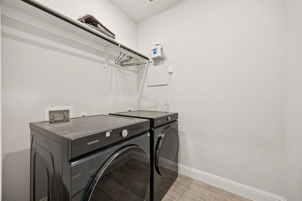 722 Cari Lane Forney, TX 75126 - Photo 33 of 40 a utility room with dryer and washer