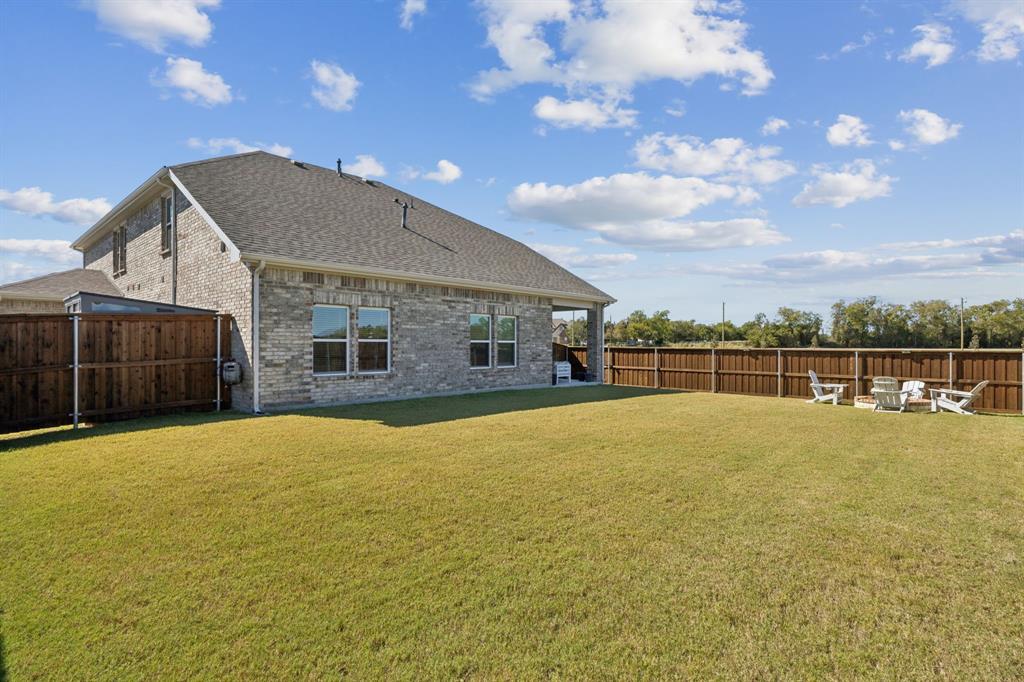722 Cari Lane Forney, TX 75126 - Photo 36 of 40 a view of a house with a yard