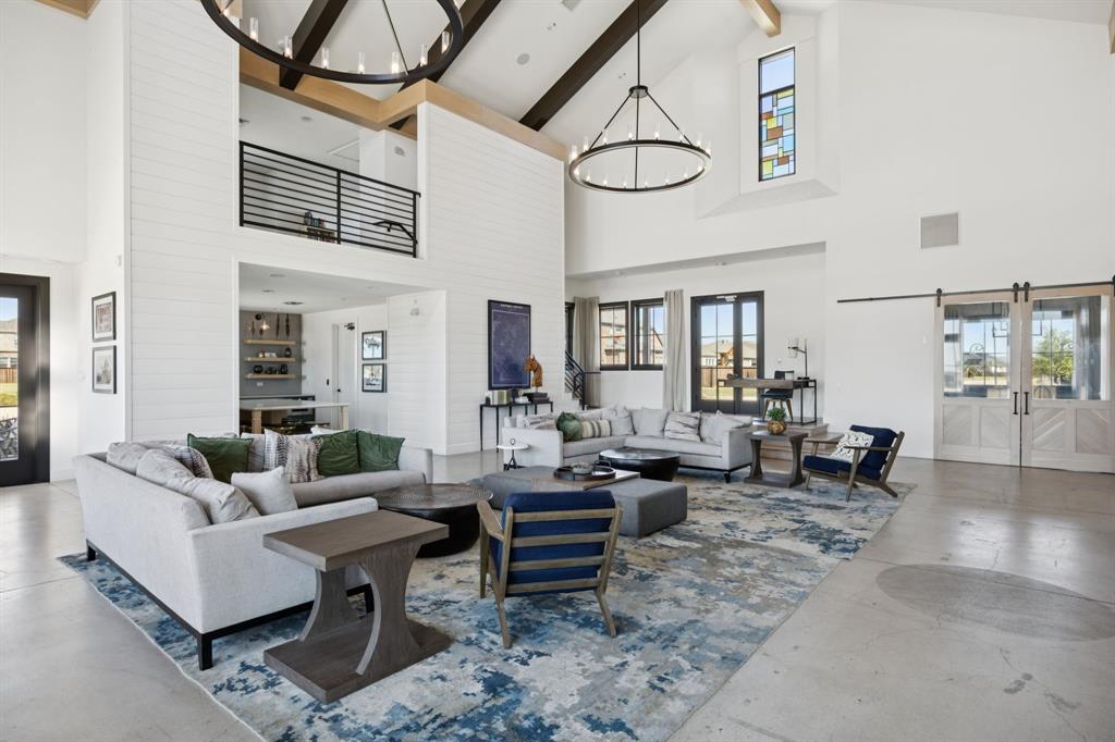 722 Cari Lane Forney, TX 75126 - Photo 40 of 40 a living room with furniture a rug and white walls
