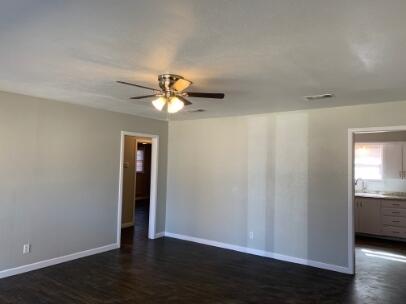 3807 26th Street Lubbock, TX 79410 - Photo 15 of 19 a view of an empty room with wooden floor