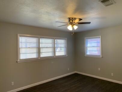 3807 26th Street Lubbock, TX 79410 - Photo 17 of 19 a view of a room with a window and a fan