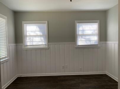 3807 26th Street Lubbock, TX 79410 - Photo 18 of 19 an empty room with wooden floor and windows