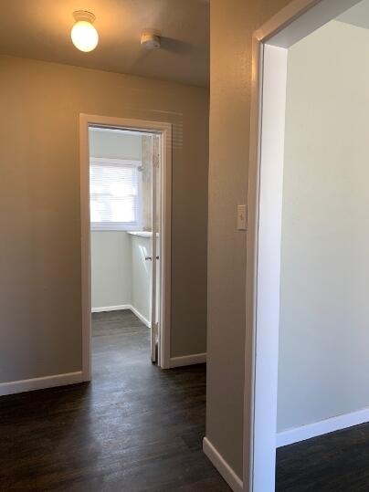 3807 26th Street Lubbock, TX 79410 - Photo 4 of 19 a view of an empty room with wooden floor and a window