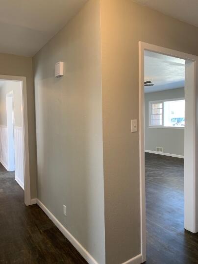 3807 26th Street Lubbock, TX 79410 - Photo 10 of 19 an empty room with wooden floor and windows