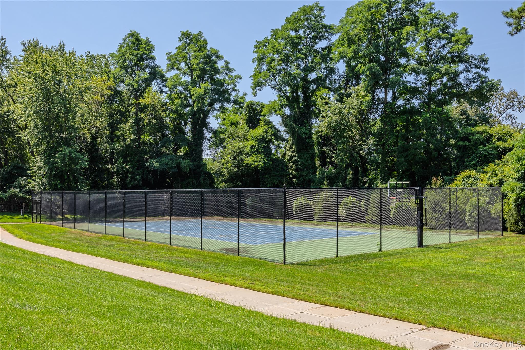 655 Middle Country Road, Unit 1G1 Coram, NY 11727 - Photo 13 of 15 a view of a backyard with swimming pool