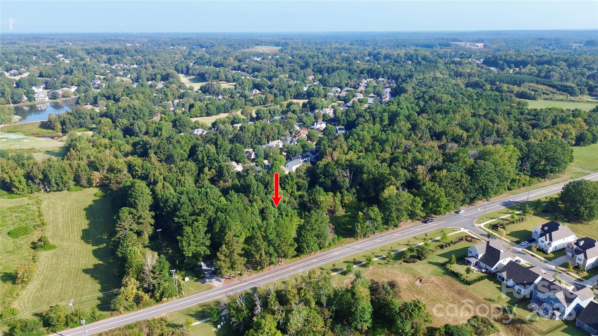 13315 Ramah Church Road Huntersville, NC 28078 - Photo 5 of 9 a view of a green field with a mountain in the background