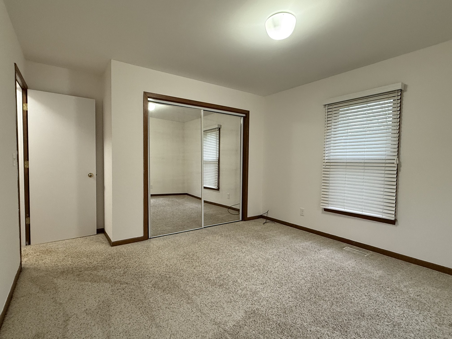 504 Old Hunt Road Fox River Grove, IL 60021 - Photo 12 of 12 an empty room with windows and closet