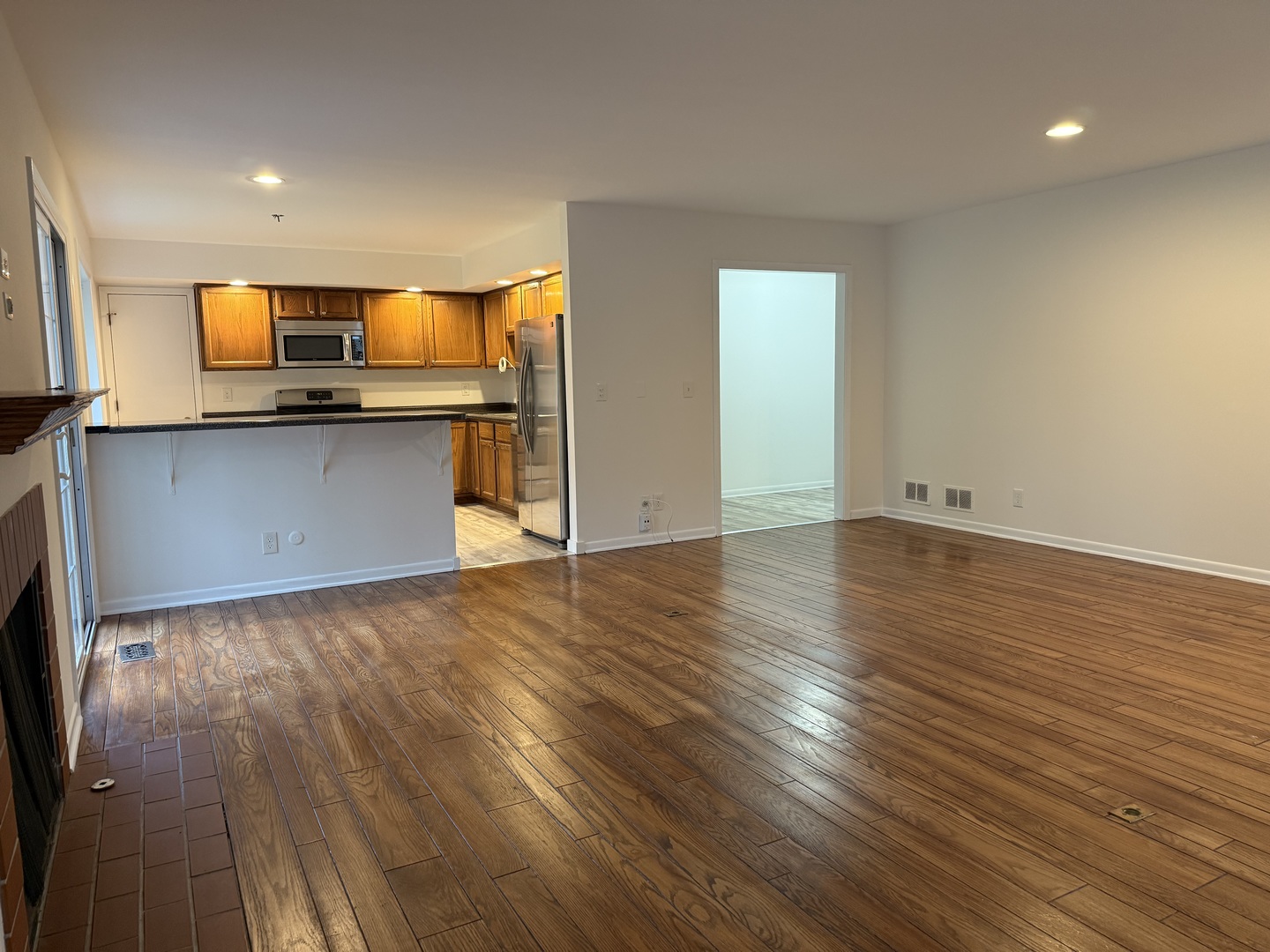 504 Old Hunt Road Fox River Grove, IL 60021 - Photo 5 of 12 an empty room with wooden floor and entrance