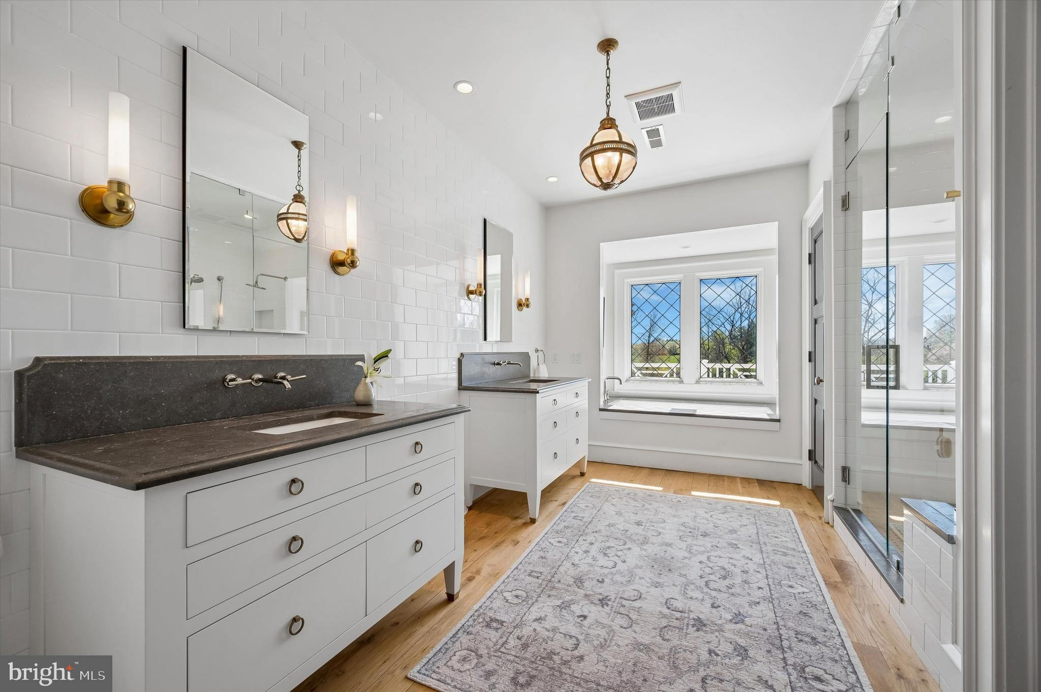 101 Hampton Lane Blue Bell, PA 19422 - Photo 42 of 68 a spacious bathroom with a granite countertop sink mirror and a bathtub