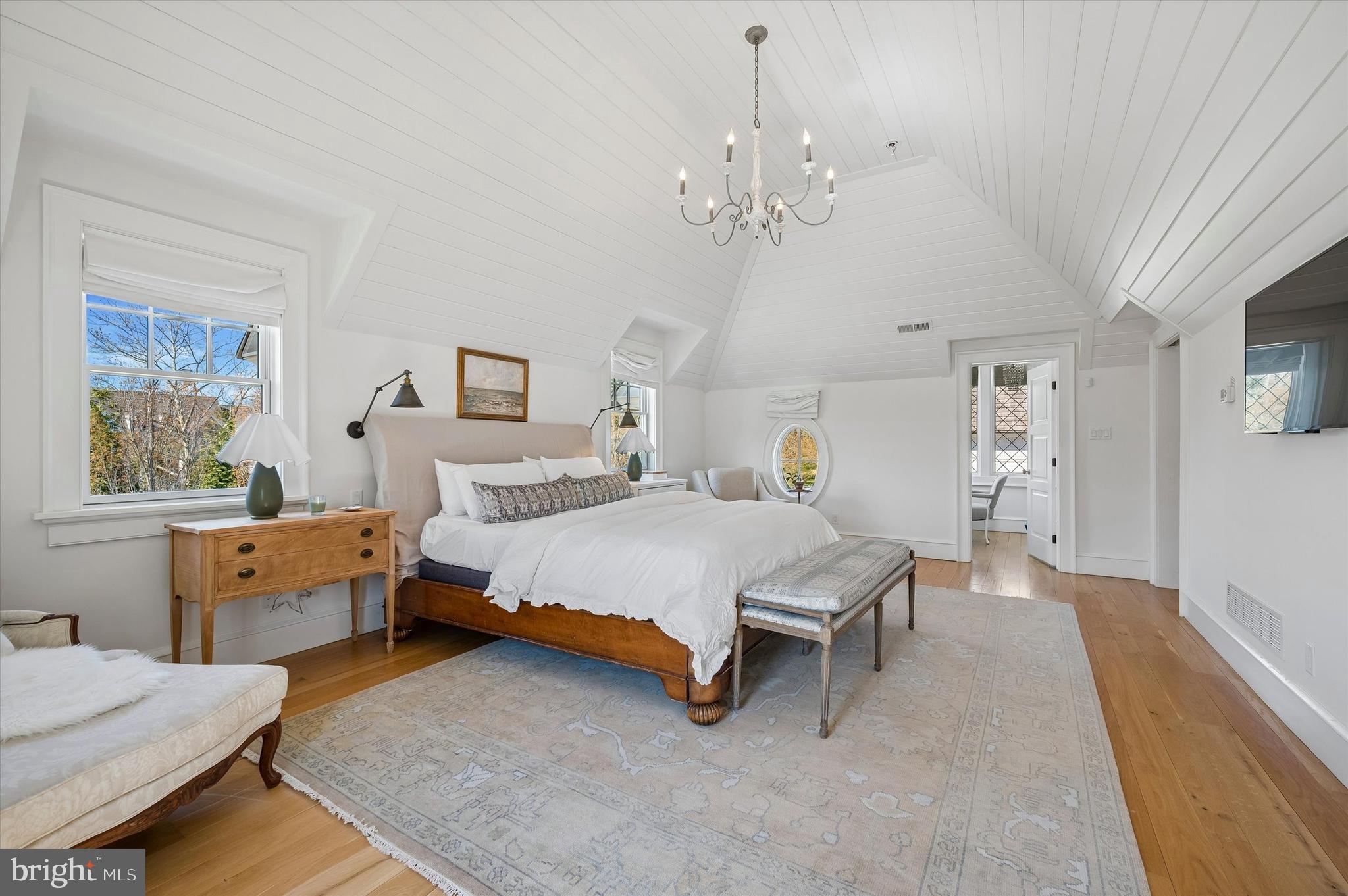 101 Hampton Lane Blue Bell, PA 19422 - Photo 46 of 68 a spacious bedroom with a bed and a table chair