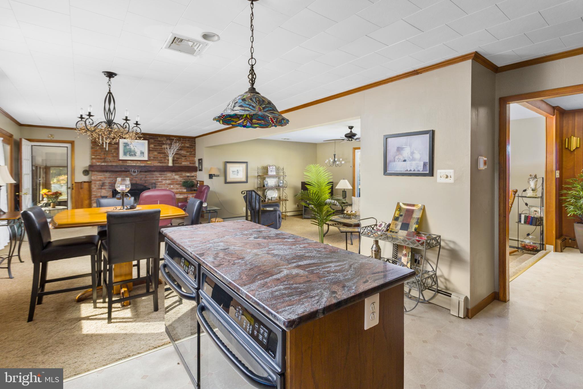 193 Burlington Path Road Cream Ridge, NJ 08514 - Photo 18 of 51 a open kitchen with a table and chairs in it