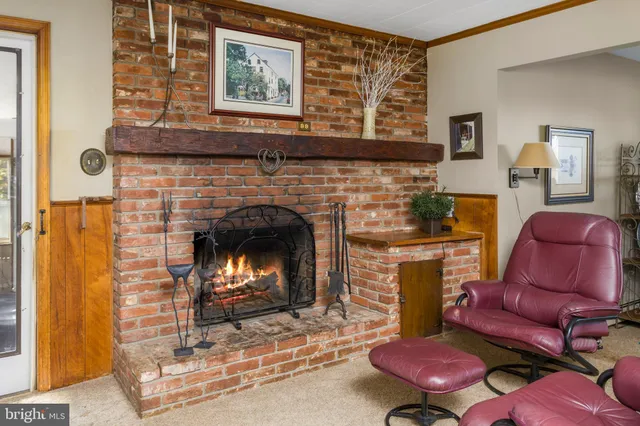 a bedroom with a bed mirror and window