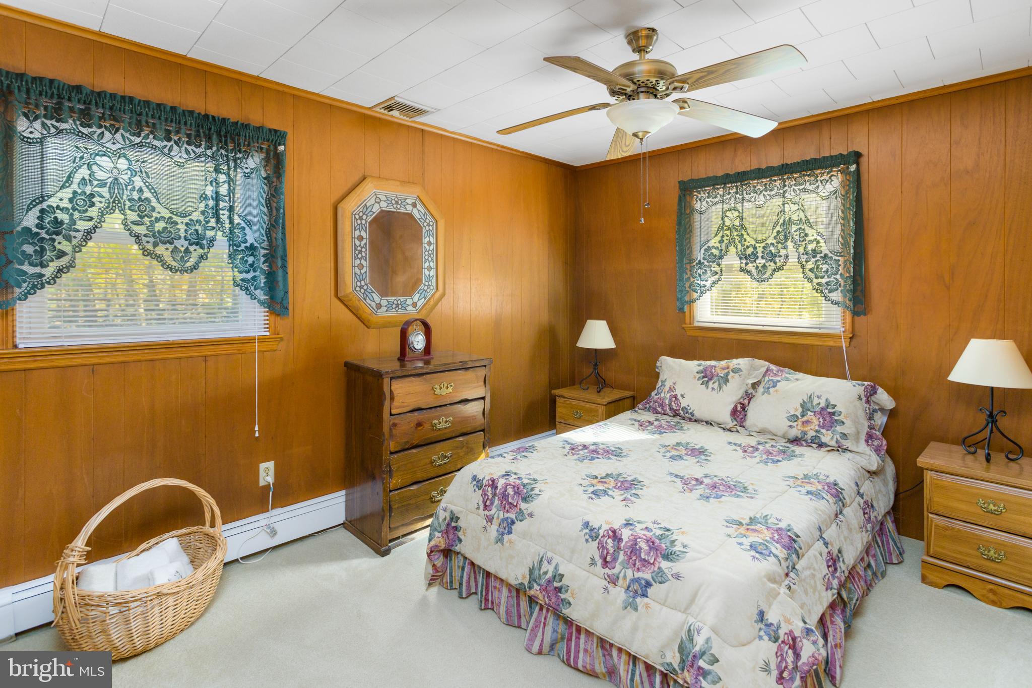 193 Burlington Path Road Cream Ridge, NJ 08514 - Photo 24 of 51 a bedroom with a bed and a painting on the wall