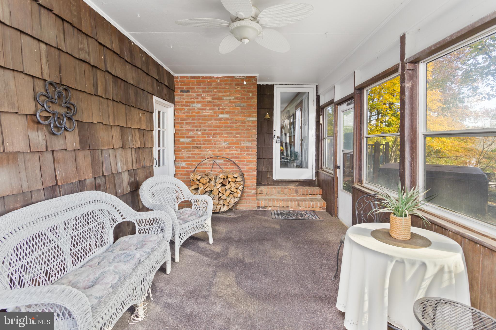 193 Burlington Path Road Cream Ridge, NJ 08514 - Photo 30 of 51 a bedroom with furniture and large windows