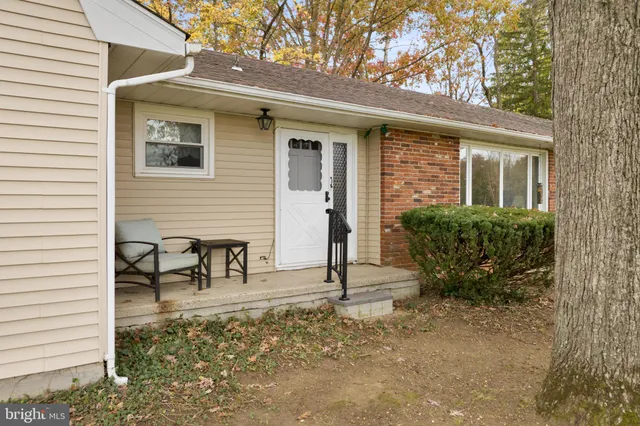 a dining room with a table and chairs