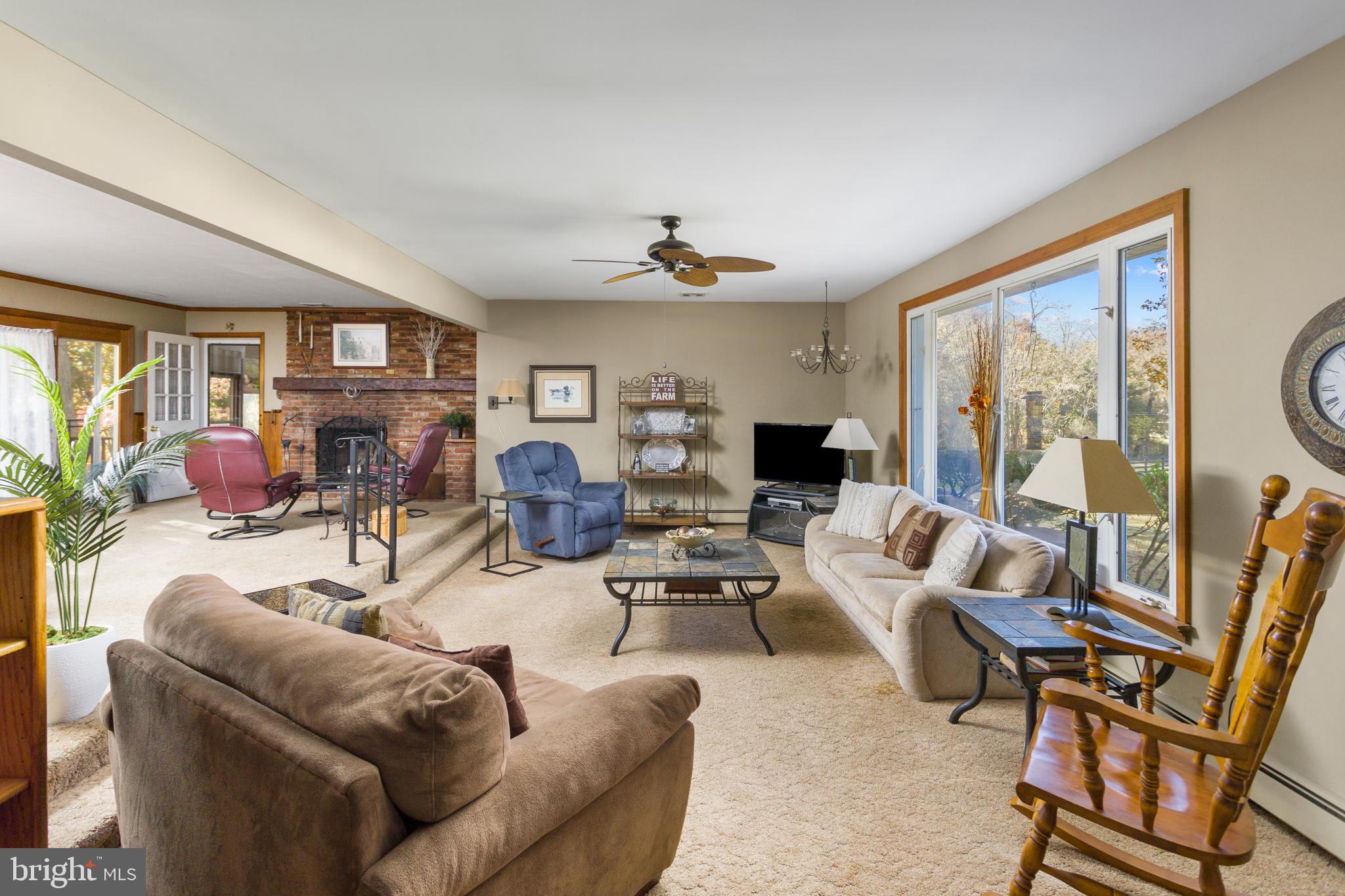 193 Burlington Path Road Cream Ridge, NJ 08514 - Photo 10 of 51 a living room with furniture and a large window